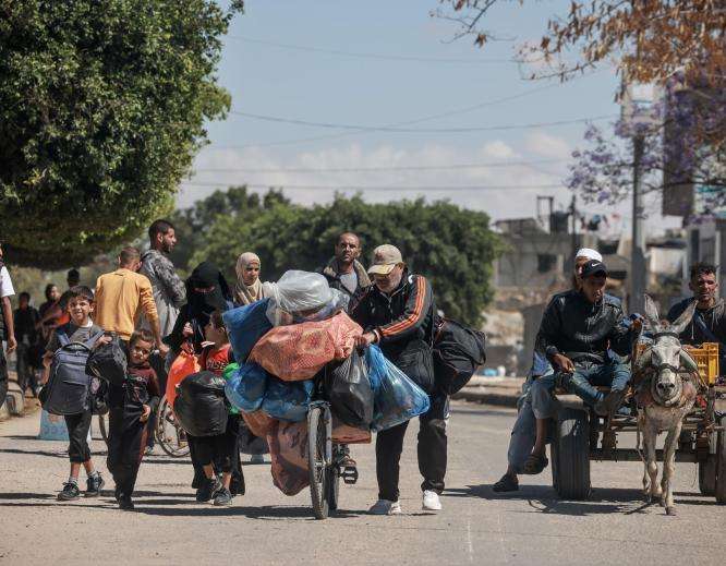 Displaced Palestinians flee Rafah.