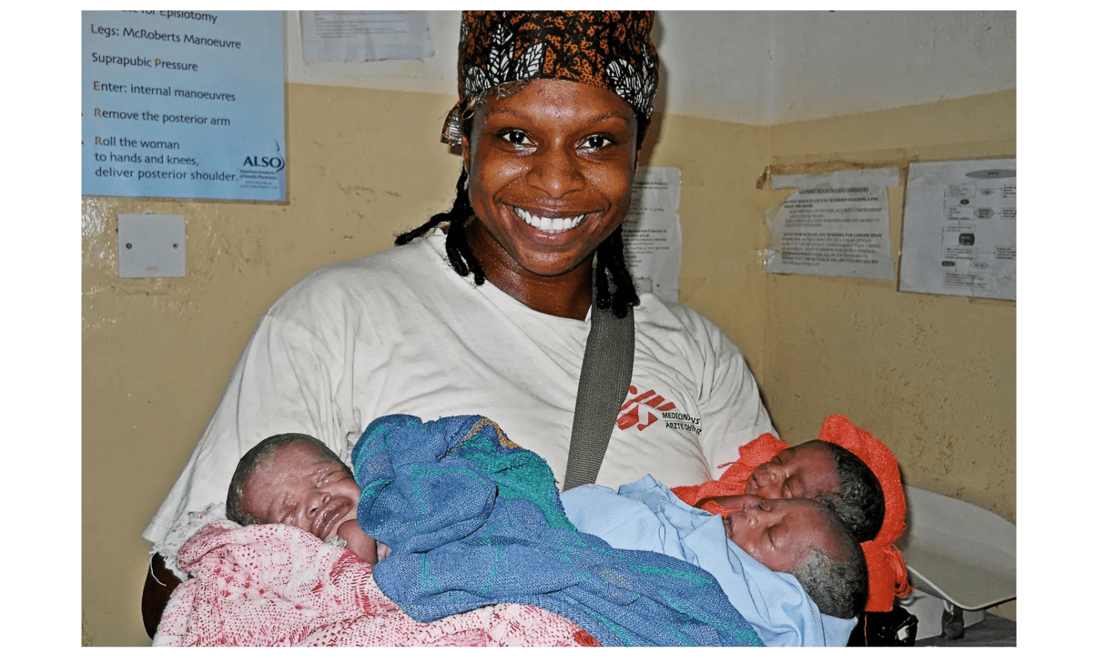Dr. Africa Stewart holding newborn babies