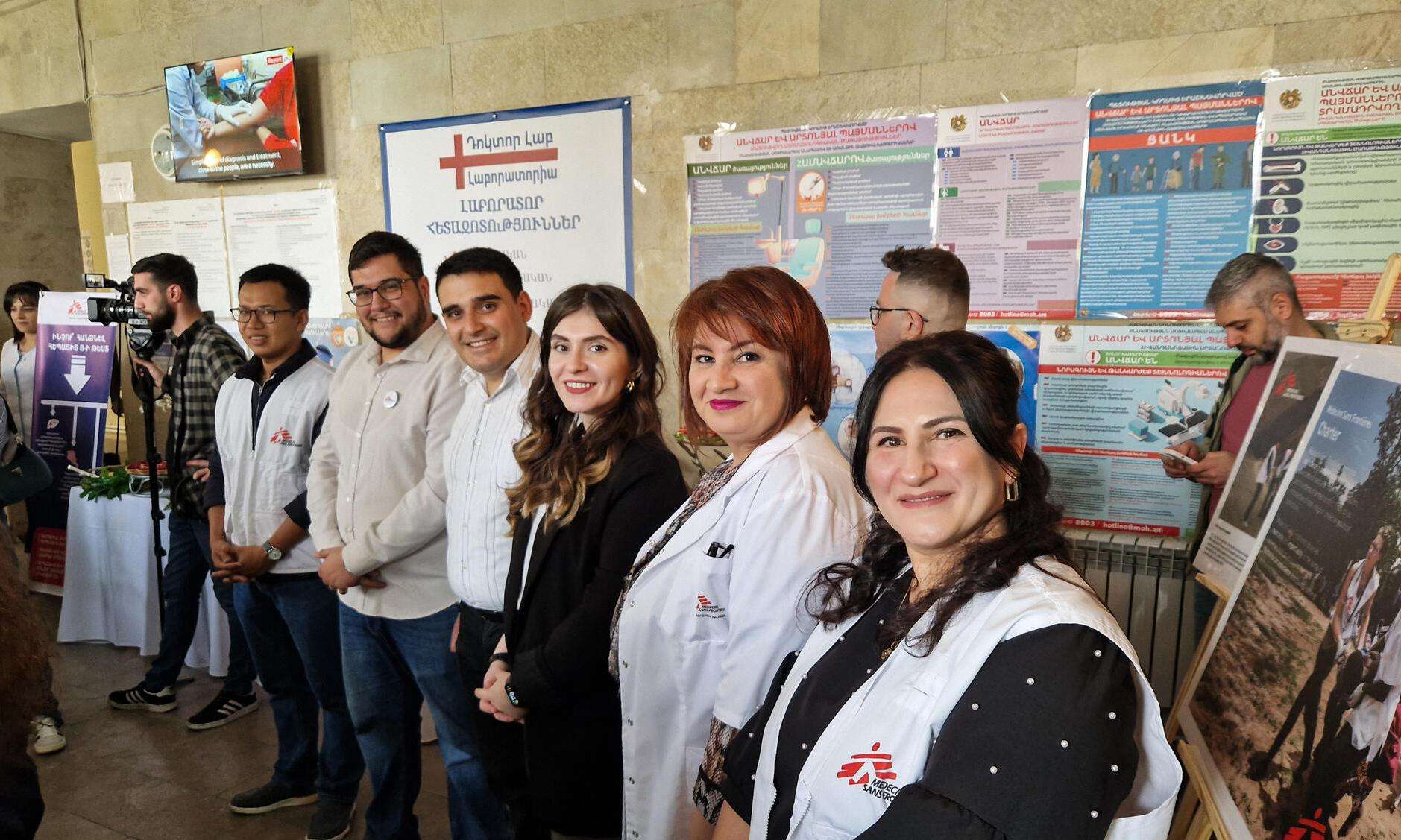 Smiling staff at the opening of a new hepatitis C clinic in Yerevan