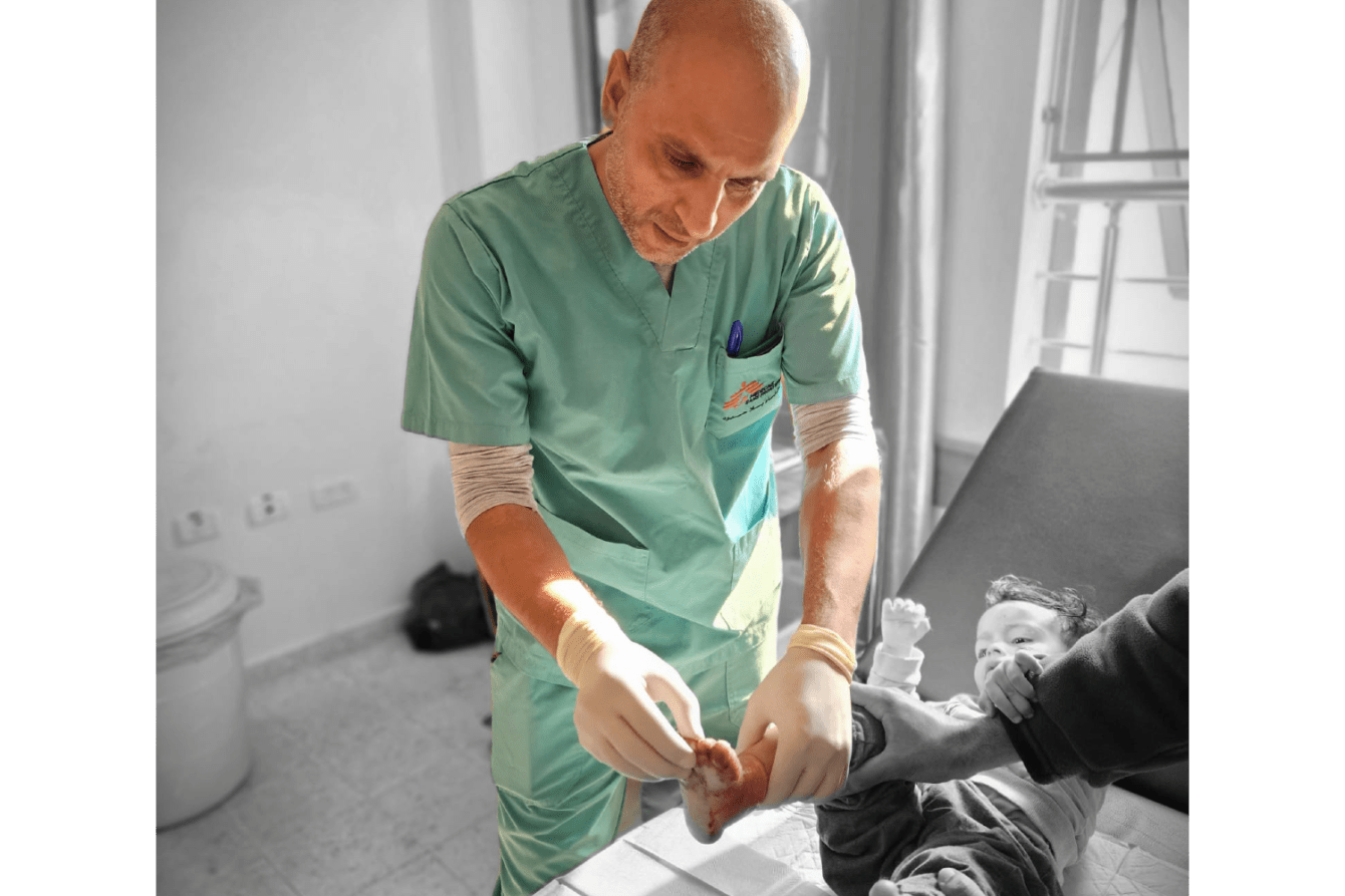 A doctor checks a child's foot at Nasser Hospital in Khan Younis, Gaza, on December 12.