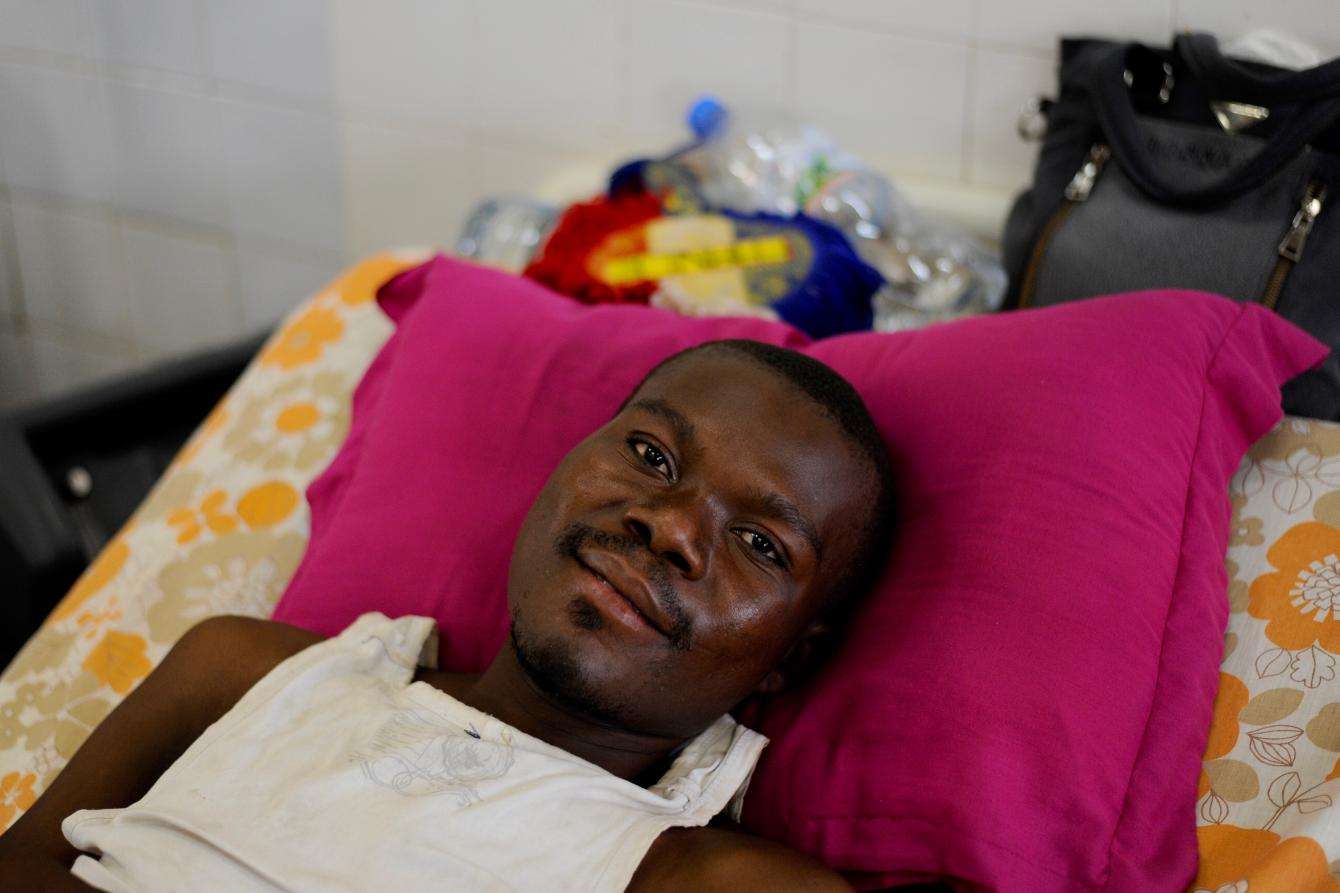 Portrait of a smiling man on a hospital bed