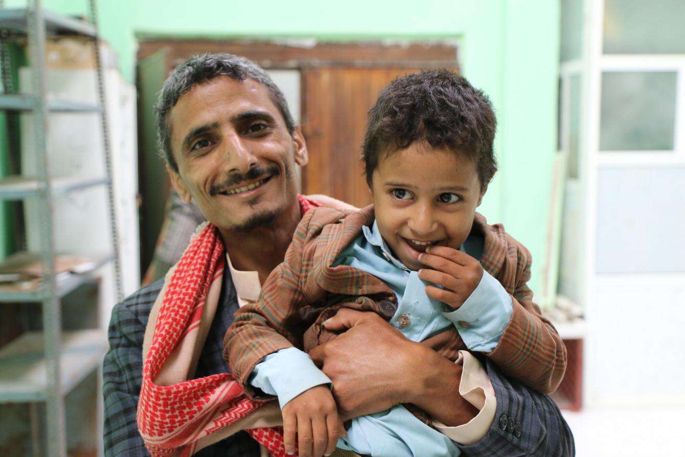 Hamdan and his son Hashid share a smile at Al-Gamhouri Hospital in Hajjah as Hamdan completes his mental health treatment.