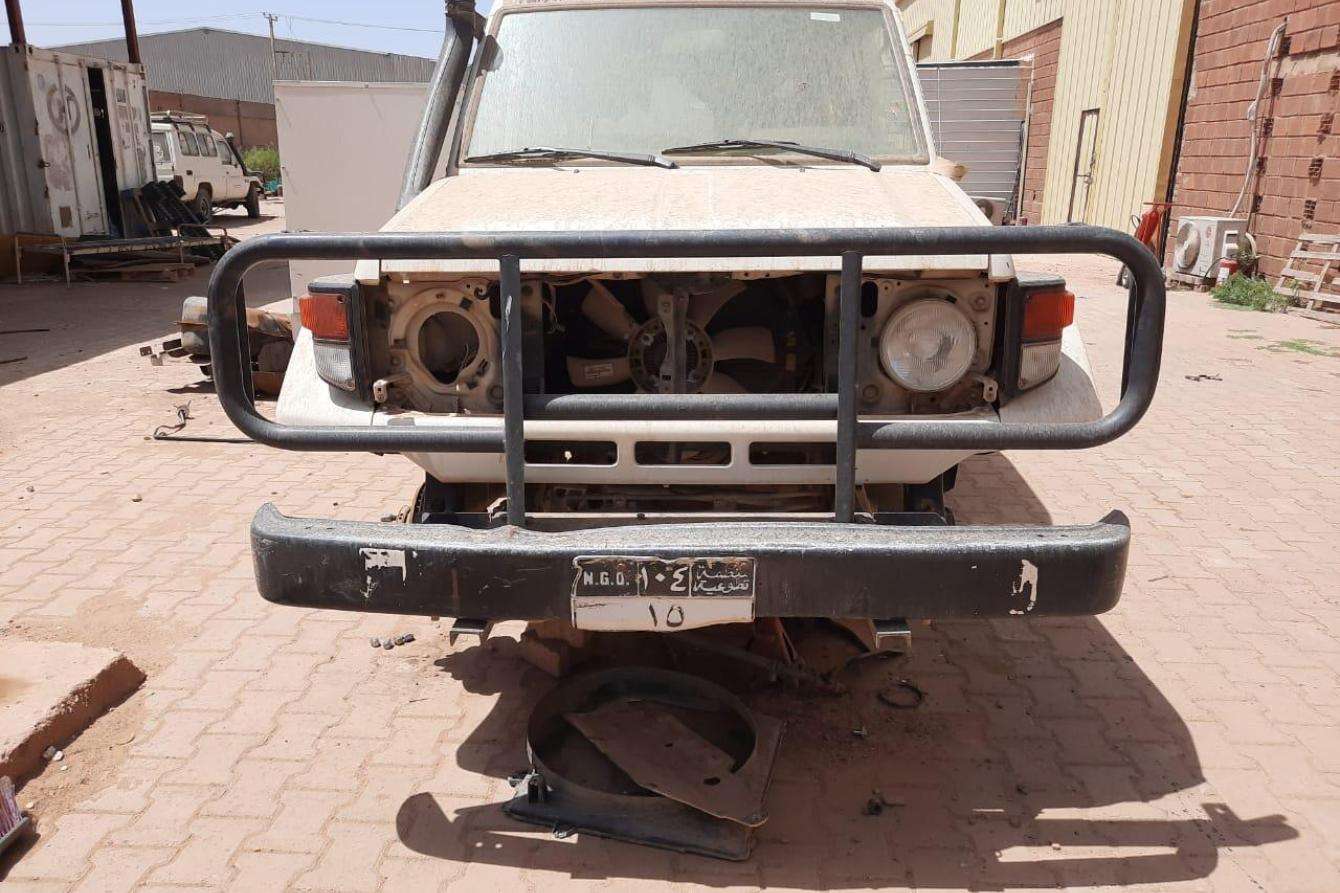 A car stripped of its tires during a looting in Khartoum, Sudan.