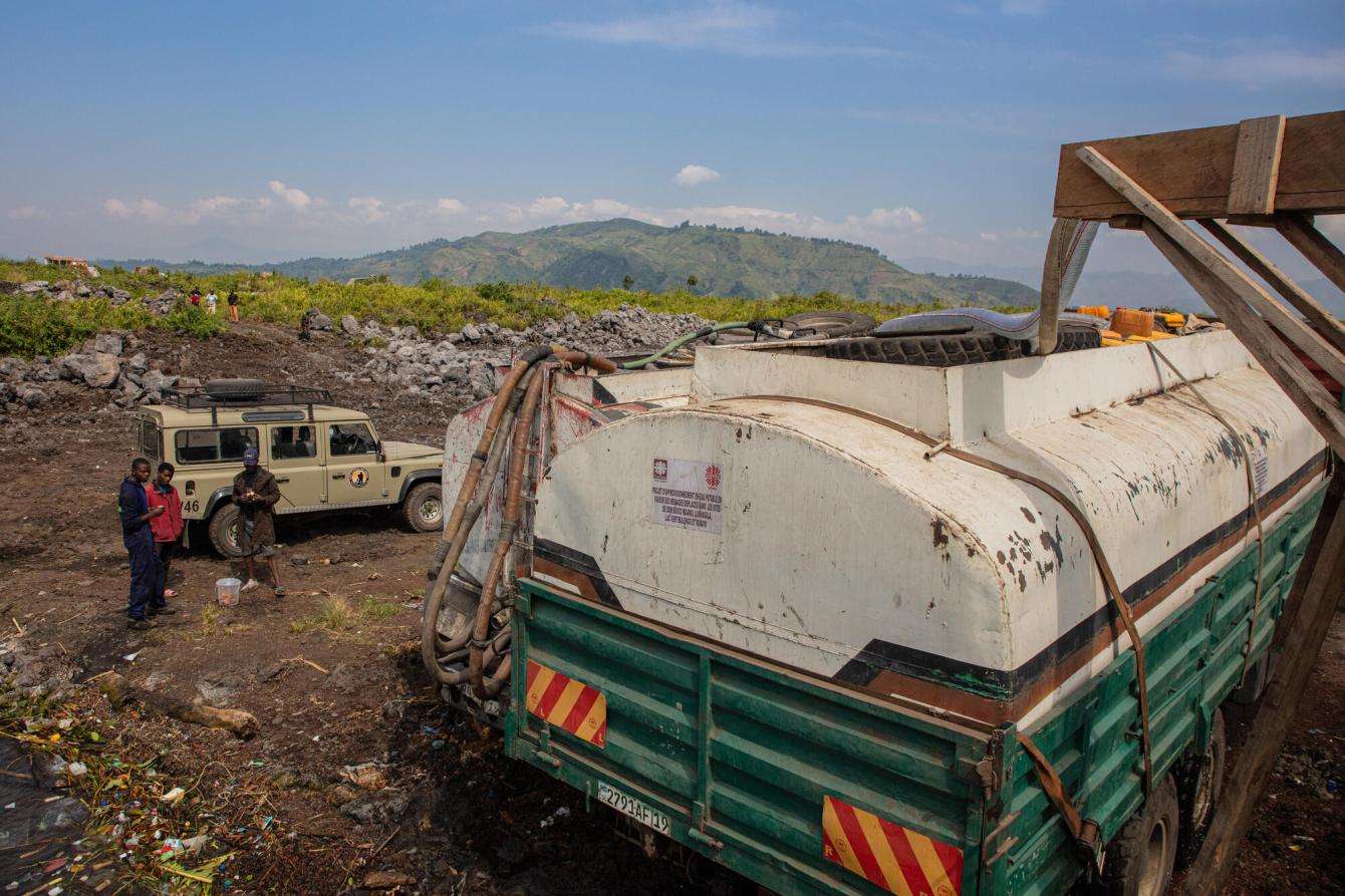 MSF water distribution team trucks near Lake Kivu, Democratic Republic of Congo