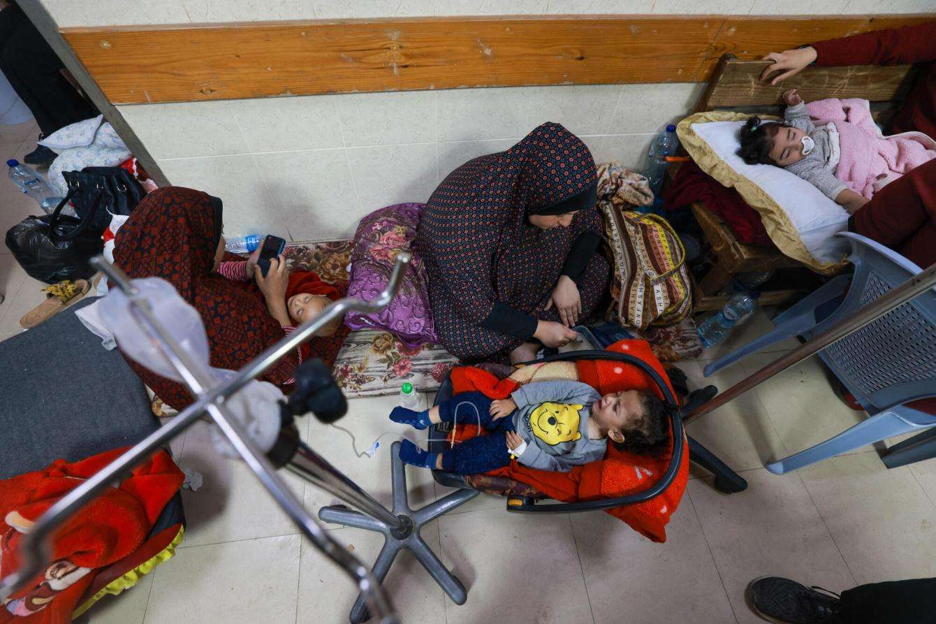 Patients and people sheltering in Al Aqsa hospital on November 29 in Gaza.