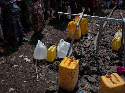 Empty water jugs at Lushagala displacement camp near Goma, Democratic Republic of Congo