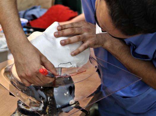 An MSF team member in Gaza works on a prosthetic face mould for people with facial scars.
