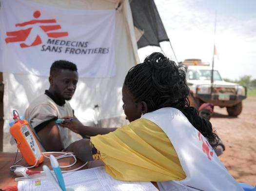 A young man is examined by MSF staff at Wedweil refugee camp in South Sudan.