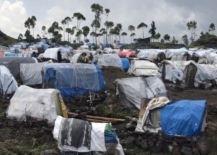 Makeshift tents under cloudy sky at Zero transit site for Sudanese refugees in South Sudan
